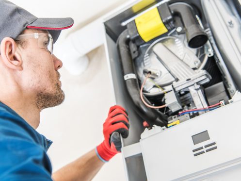 technician diagnosing a furnace heater